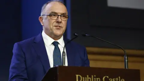 PA/Damien Storan Refenda Returning Officer Barry Ryan, at Dublin castle, reads the final result