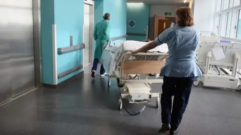 Getty Images Nurse and hospital porter