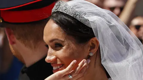 PA Meghan Markle in the carriage after marrying Prince Harry