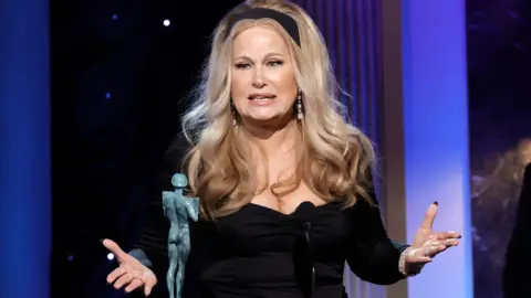 Getty Images Jennifer Coolidge accepts the Outstanding Performance by a Female Actor in a Drama Series award for "The White Lotus" onstage during the 29th Annual Screen Actors Guild Awards at Fairmont Century Plaza on February 26, 2023 in Los Angeles, California