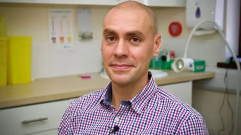 Martin Giles/BBC Dr Peter Smye