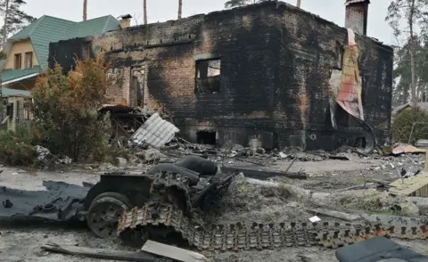 BBC The home of Artem Hurin's mother-in-law was burned down during the Russian occupation