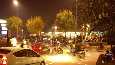 @PeopleofLeeds A photograph shows a large group gathered on the road