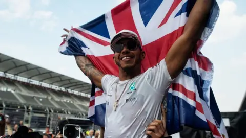 PA Lewis Hamilton after winning his fourth F1 title in Mexico