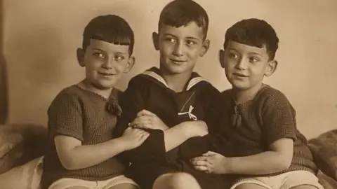 Family photo The twins and their elder brother who died in a concentration camp