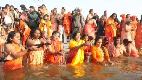 Ankit Srinivas Women taking a dip at the Sangam