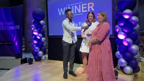 Jamil Foster presenting The Together Award to The Long Table