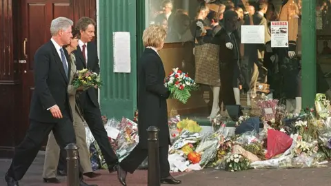 JOYCE NALTCHAYAN / Getty Images Bill Clinton, Hillary Clinton, Tony Blair and Cherie Blair at scene of Omagh bomb.