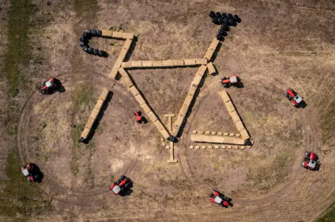 Mads Claus Rasmussen/Ritzau Scanpix/via REUTERS Land art is seen from a drone along the route of the 3rd. stage of the Tour de France, in Jutland, Denmark, June 23, 2022.