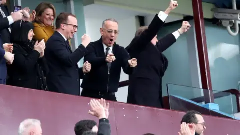 PA Media Tom Hanks cheering in football stand