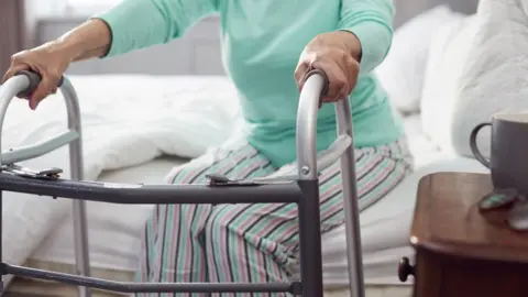 Getty Images woman with walking frame