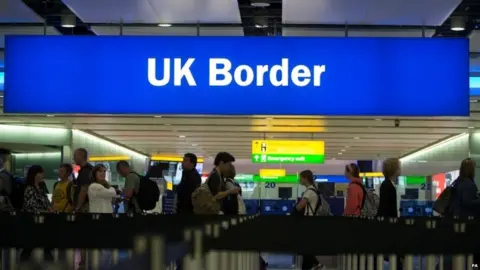 PA Passport control at Heathrow airport