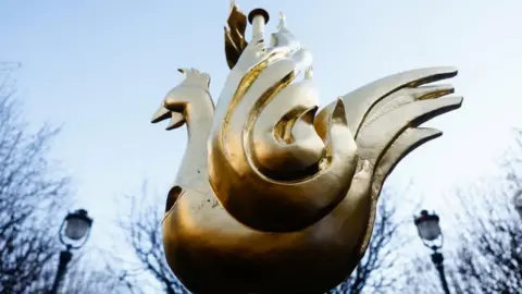 Reuters A golden copper weathervane in the shape of a rooster scene before being fitted to the new spire of Notre-Dame cathedral.