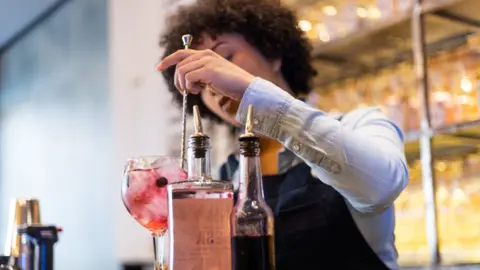Getty Images Bar worker