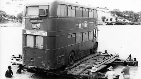 Mike Conway Bus on raft on River Chira, Peru