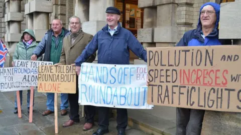 Daniel Jaines People with placards protesting outside Grimsby Town Hall