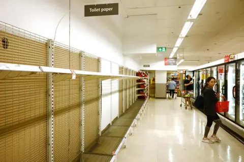 Getty Images Barren shelves in a Sydney supermarket