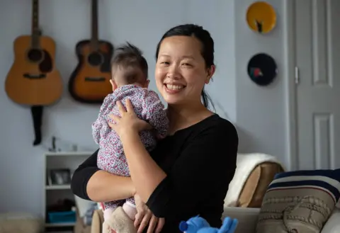 Nina Raingold A portrait of Amy with her baby daughter Elowen