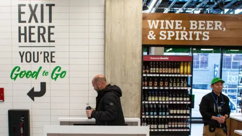 Getty Images A shopper exits Amazon Go Grocery on February 26, 2020 in Seattle, Washington.