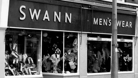 Swann Menswear Old photo of shop front