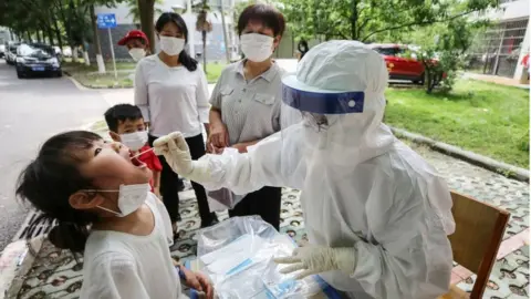 AFP Testing for the virus in Wuhan