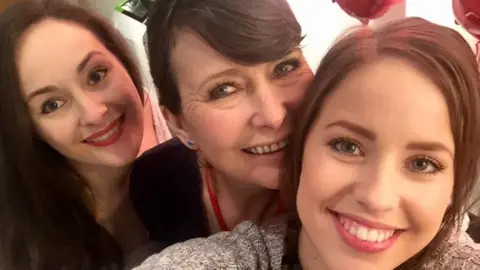 Vikie Shanks with twins Lorie (left) and Mirie