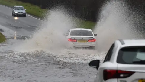 Pacemaker Car drives through flood on the Moira Road