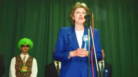 Getty Images Theresa May giving a speech