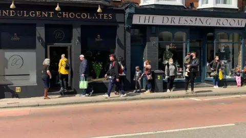 Indulgent Chocolates Queue outside Indulgent Chocolates on opening day