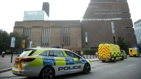 PA Media Police car and ambulances outside the Tate Modern