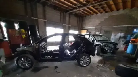 Nottinghamshire Police The chassis of two vehicles in a residential garage