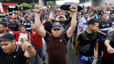 Migrant caravan heads to US as key summit begins