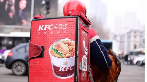 Getty Images Yum China, which runs KFC and Pizza Hut restaurants, listed its shares on the Hong Kong stock exchange.