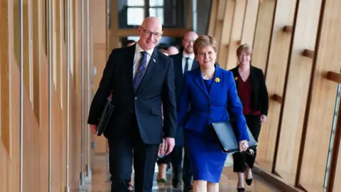 PA Media Sturgeon and Swinney