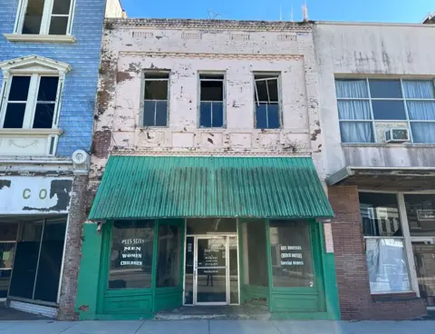Neglected businesses line the street of Orangeburg's downtown historic district