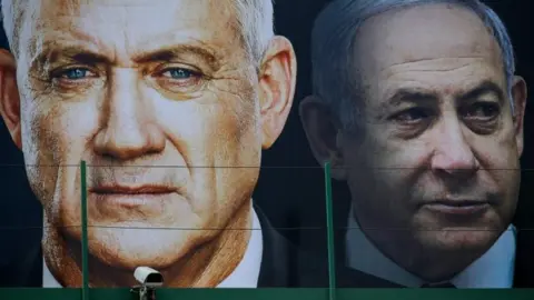 AFP File photo shows election poster in Ramat Gan, Israel, featuring Benny Gantz (left) and Benjamin Netanyahu (right) (17 February 2020) AFP