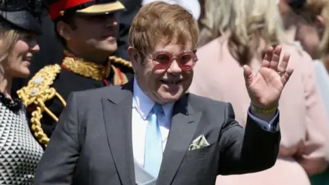 Getty Images Elton John waving at the crowds