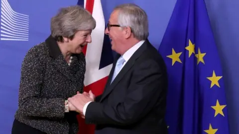 Reuters Theresa May with Jean-Claude Juncker