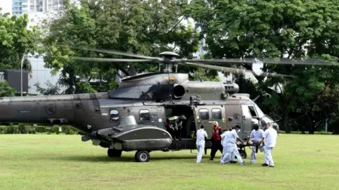 Reuters A Singapore Air Force helicopter transports wounded to hospital
