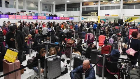 PA Media Waiting passengers