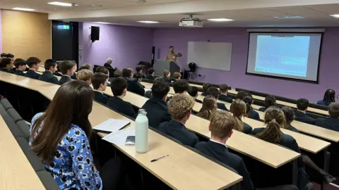 Students listening to Smajo Bëso