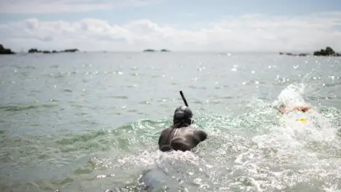 AFP Ben Lecomte begins his swim in Choshi, Chiba prefecture, Japan, 5 June