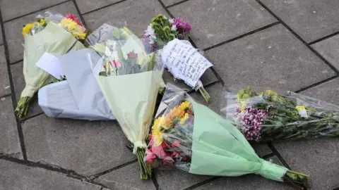 PA Media Flower tributes