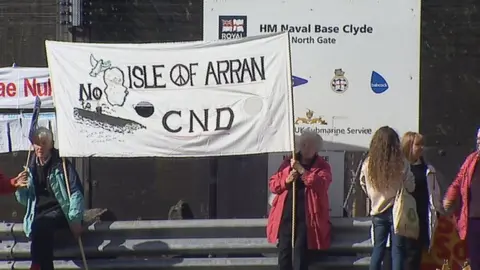 BBC Demonstrators gathered at the gates to the base