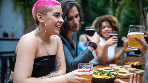 Getty Images Group seated outdoors eating