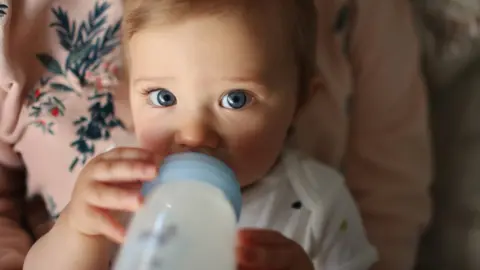 Getty Images Baby drinking milk