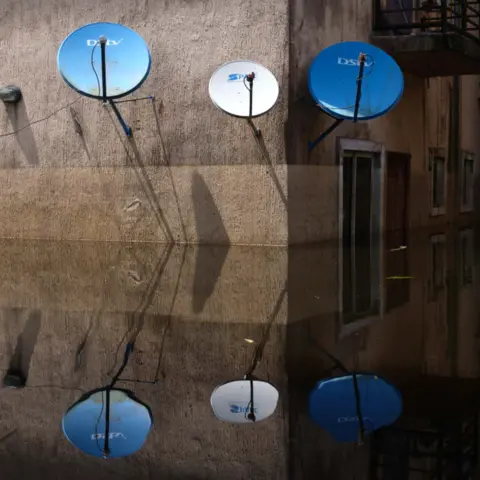 Gideon Mendel Satellite dishes at Dorca Executive Apartments (student accommodation) in Ogbia Municipality, Bayelsa State, Nigeria - November 2022
