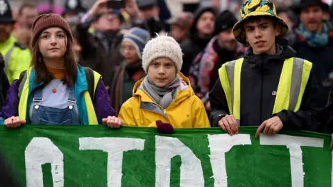 Getty Images Greta Thunberg leads the crowds through Bristol city centre