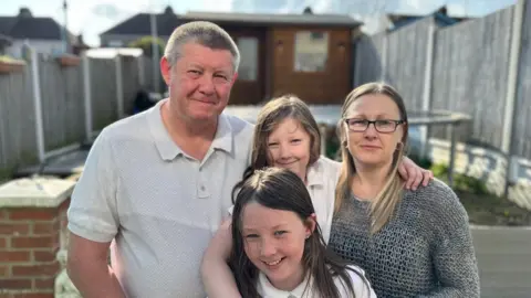 BBC News Ella with her family