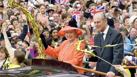 Getty Images The Queen with her husband the Duke of Edinburgh at her Golden Jubilee